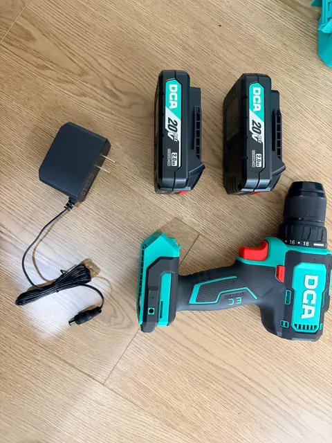 DCA ADJZ2055T tool, two batteries and charger laid out