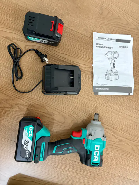 DCA ADPB320 tool, batteries and charger laid out