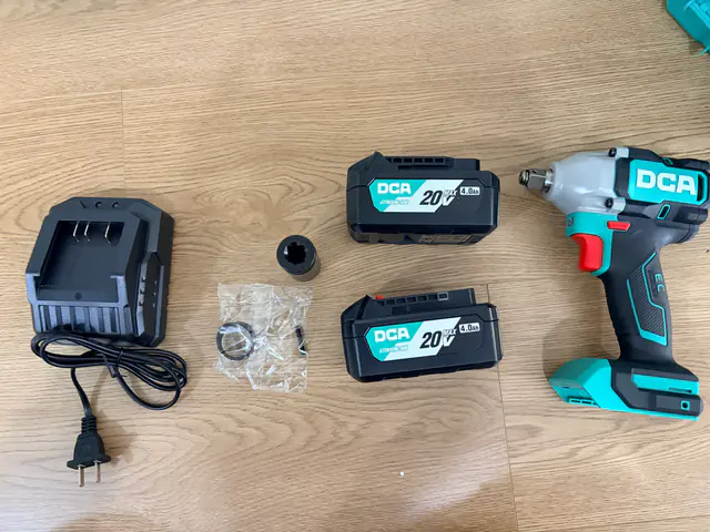 DCA ADPB520 tool, two batteries, charger and socket laid out