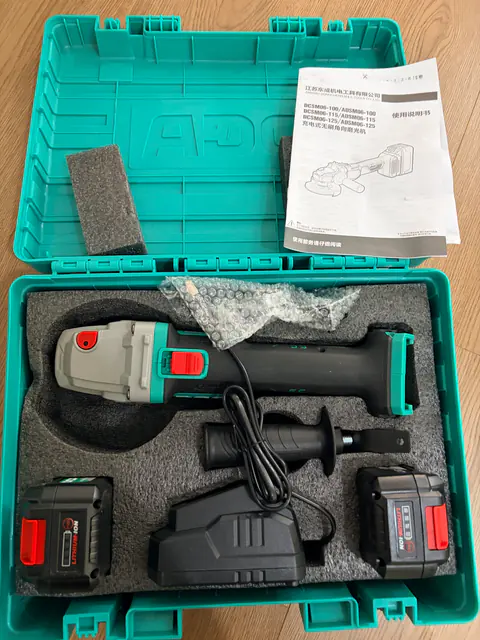 DCA ADSM06-100E photographed kit with two 4.0 Ah batteries