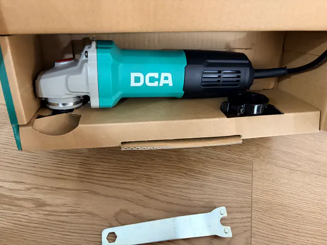 DCA ASM18-100B tool with wheel guard and wrench